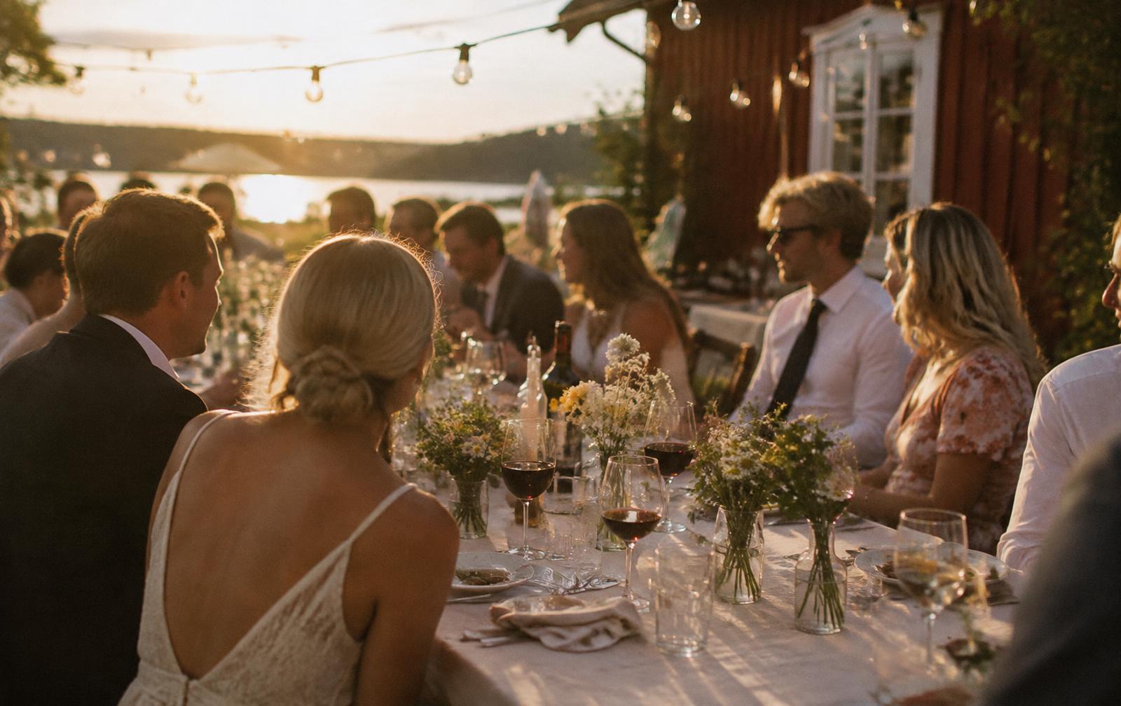 Wedding dinner on a summer evening where guests celebrate together